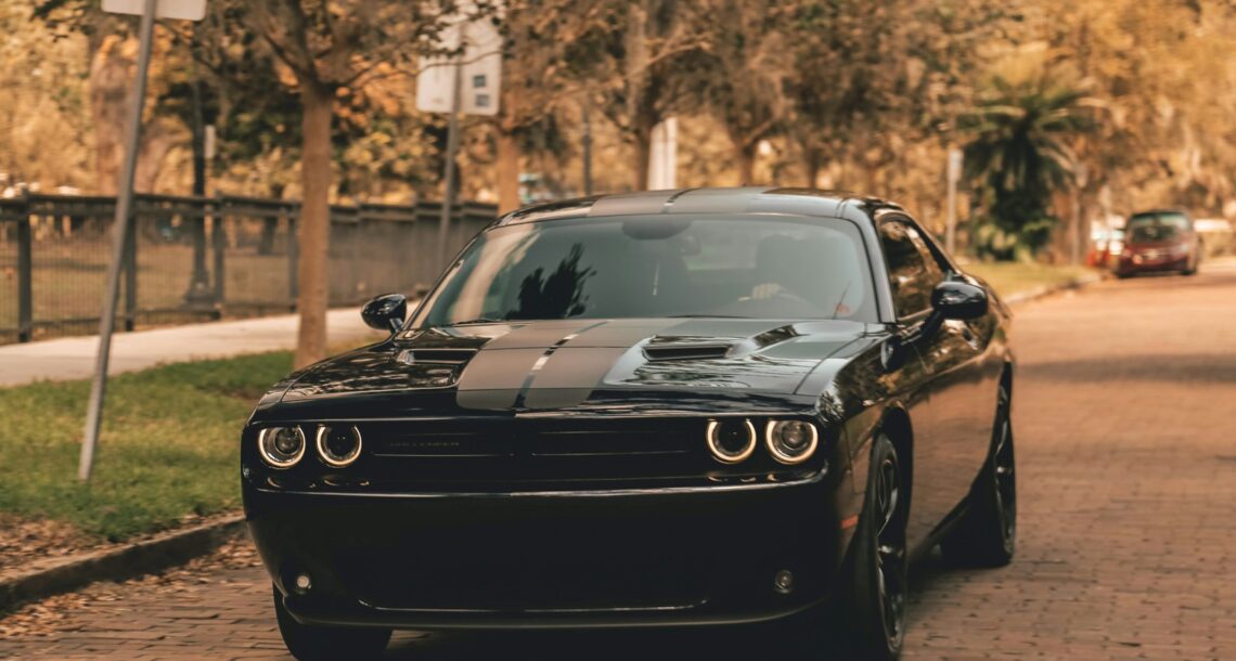 black coupe on concrete road